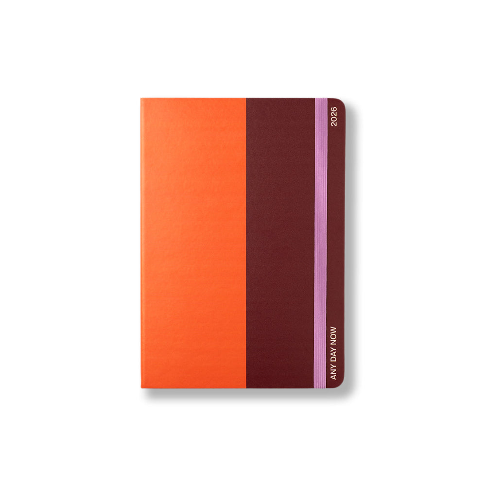 Notebook with orange and brown design on a white background