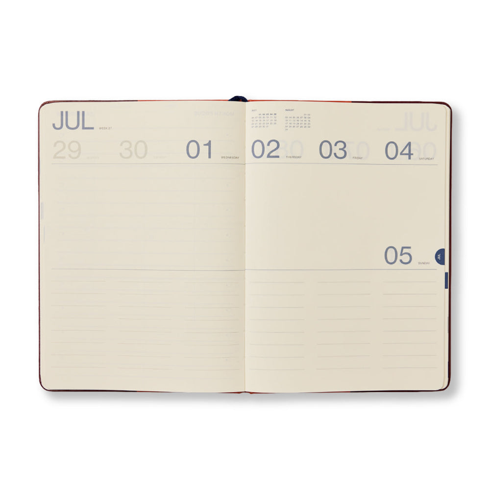 Open notebook showing a calendar page with dates on a white background