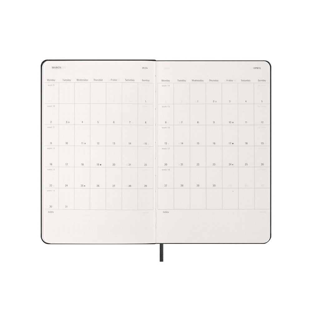 Calendar notebook open to a monthly view on a white background