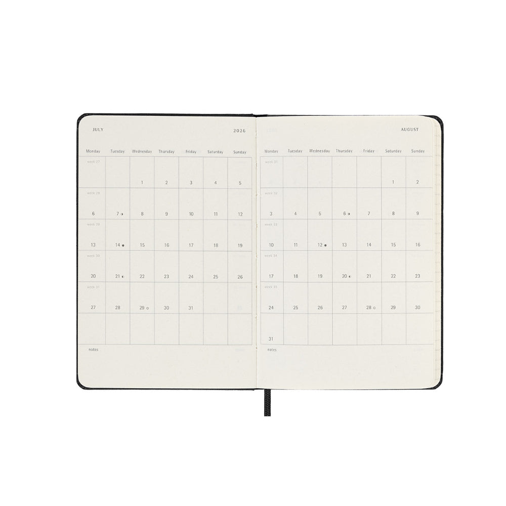 Open planner showing a monthly calendar layout on a white background