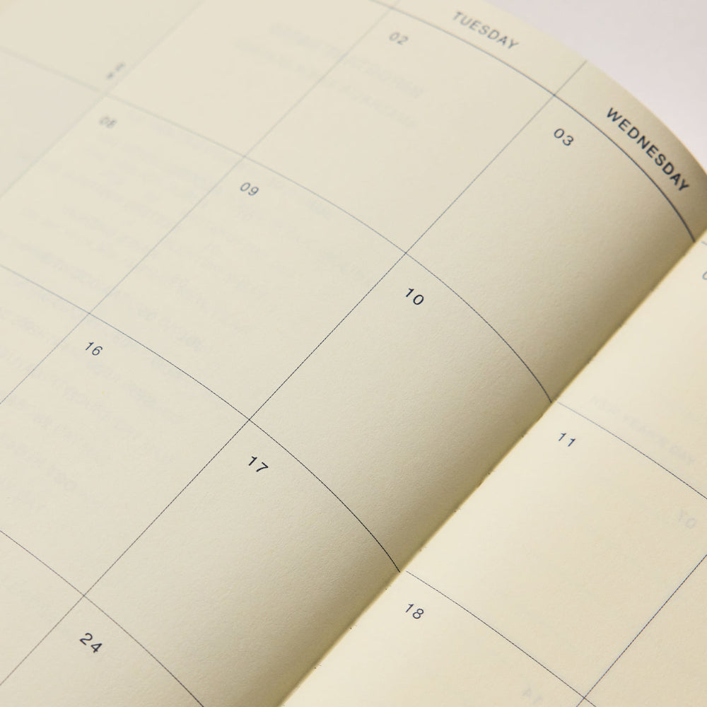 Calendar pages showing a grid layout with days of the week and numbers.