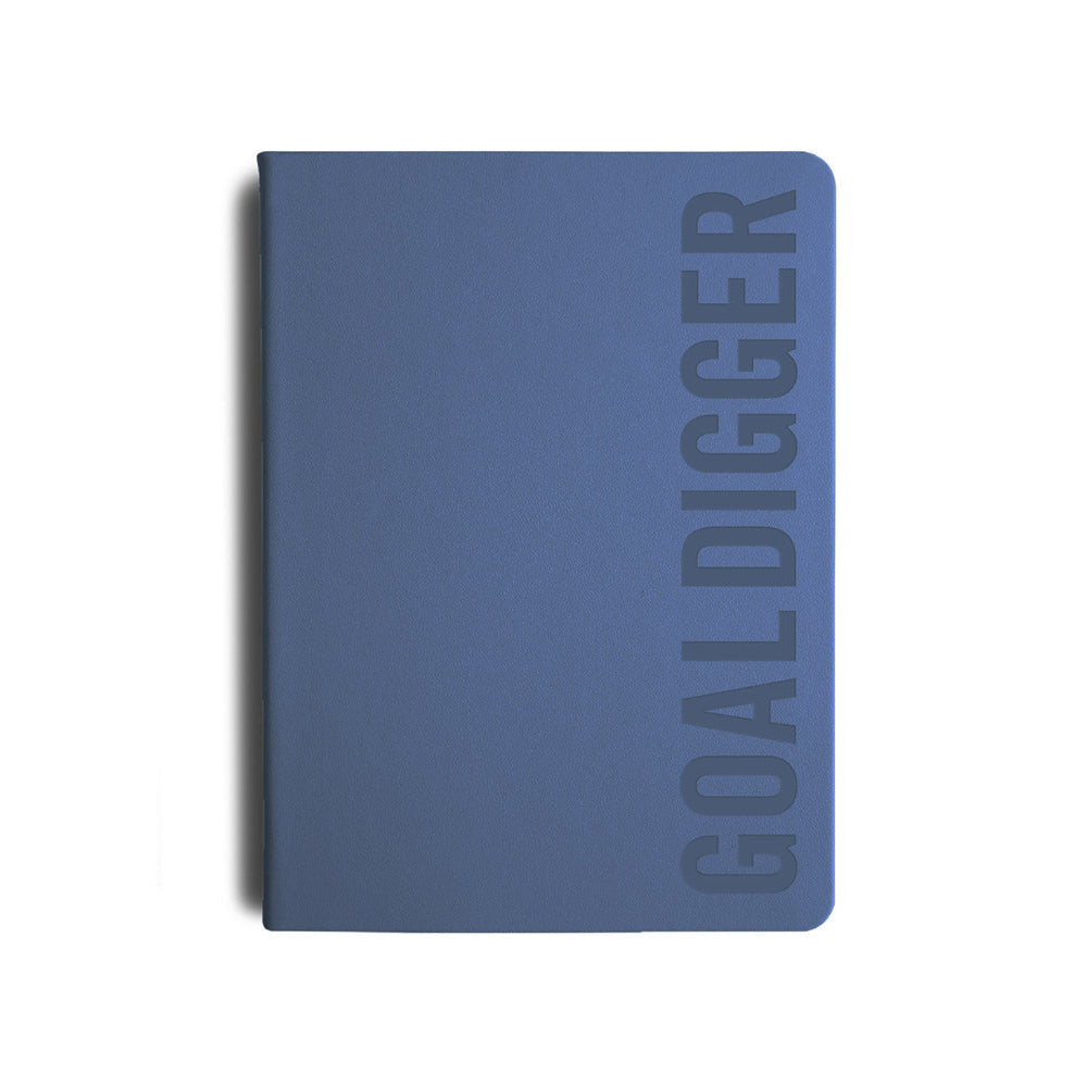 Blue notebook with 'GOALDIGGER' embossed on the cover against a white background