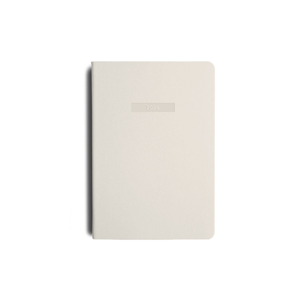 cream notebook with a "2026" embossed on the front on a white background